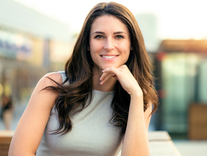 Young woman smiling at camera-introducint Ivocell