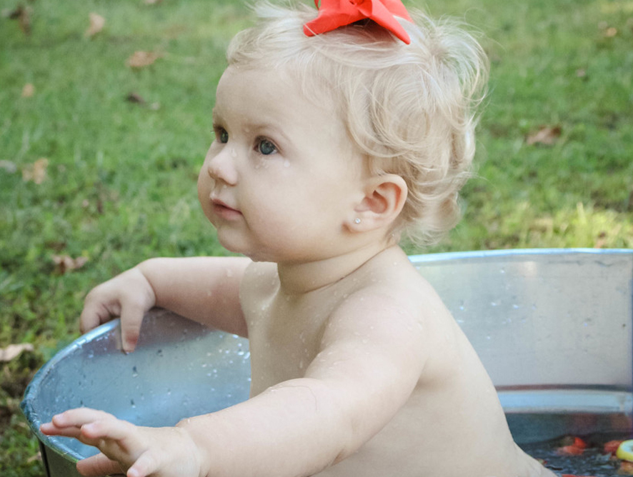 little girl playing outside - testimonial for Kelsey E.