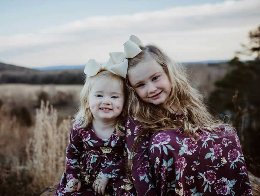 two young girls smiling